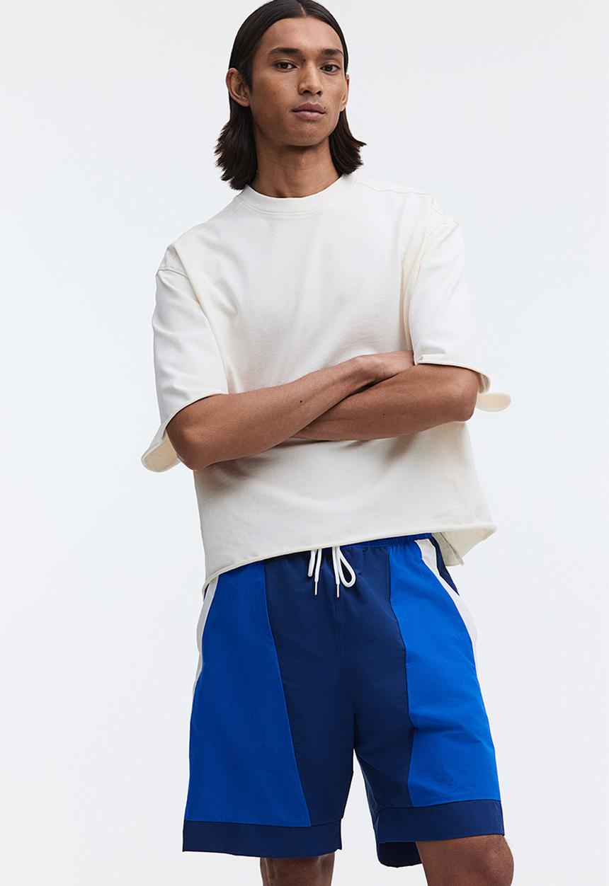 H&M - Loose fit track shorts - dark blue/colour block