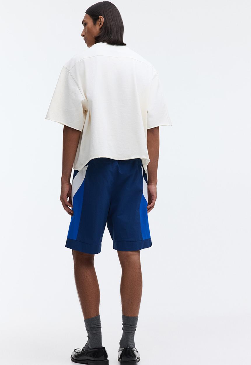 H&M - Loose fit track shorts - dark blue/colour block