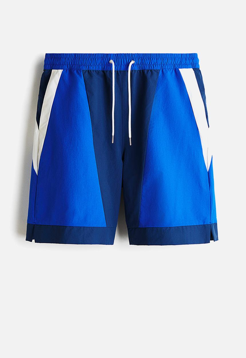 H&M - Loose fit track shorts - dark blue/colour block