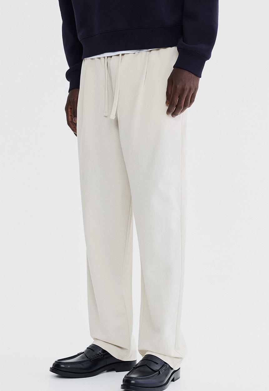 H&M - Regular fit cotton-blend trousers - light beige