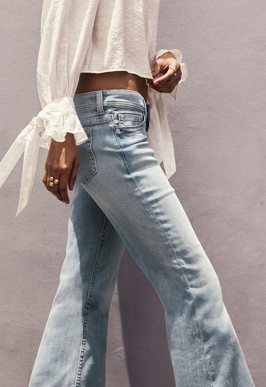 H&M - Flared leg ultra low waist jeans - light denim blue