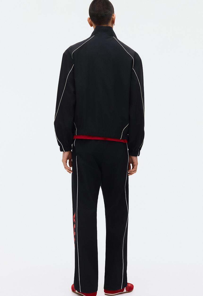 H&M - Relaxed fit printed track pants - black/honda