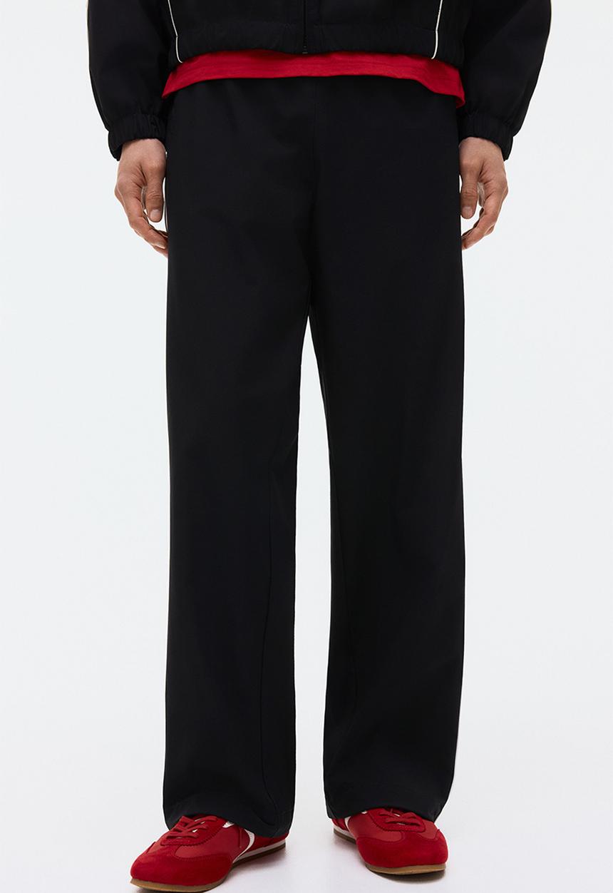 H&M - Relaxed fit printed track pants - black/honda