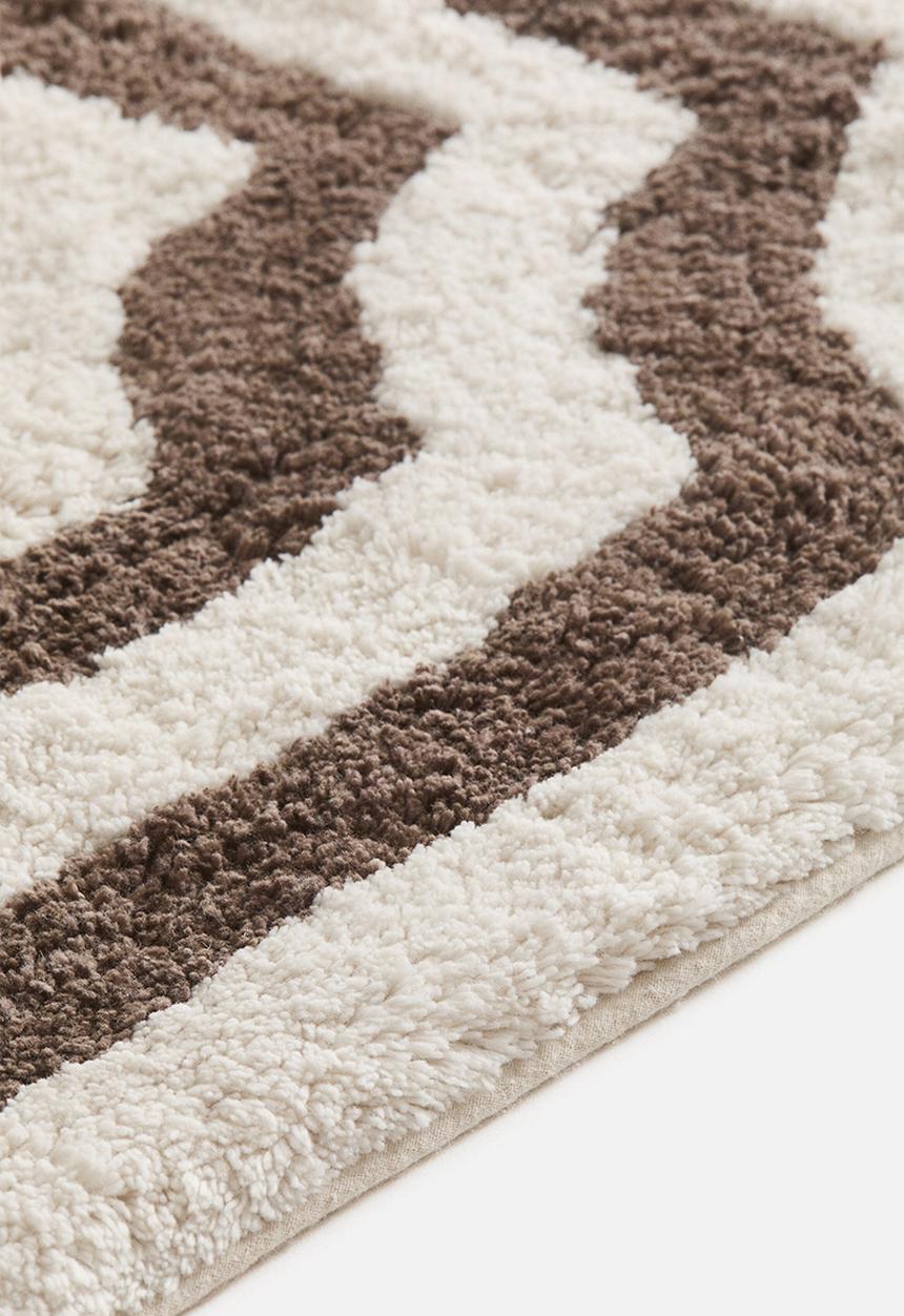 H&M - Tufted cotton bath mat - cream