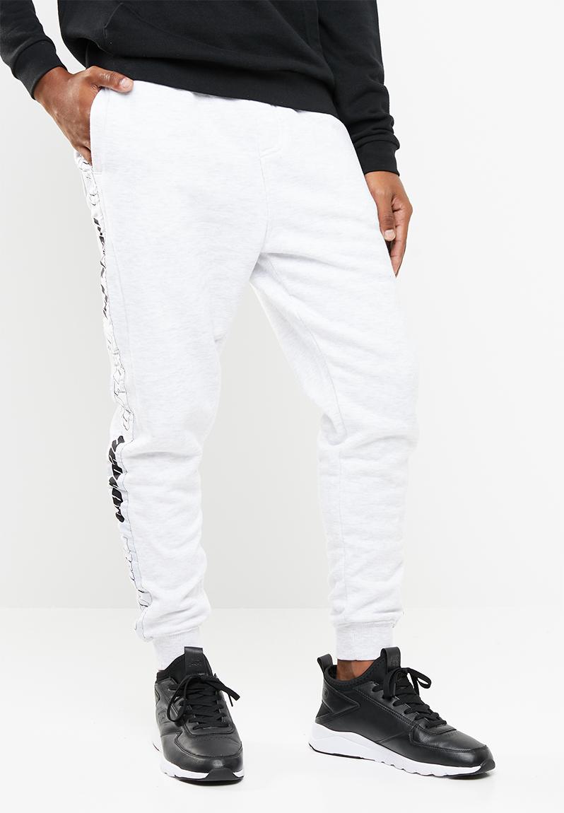 Trippy slim trackie - athletic marle/white Cotton On Pants & Chinos ...