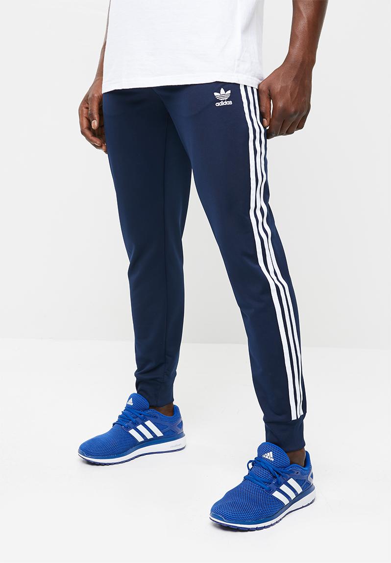 adidas sst track pants navy blue