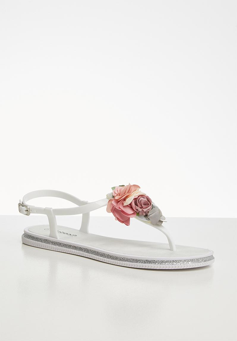 Levanzo faux leather embellished flower flat t-strap sandal - white ...