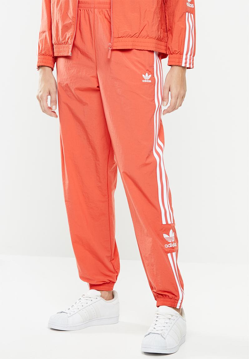 orange and white track pants