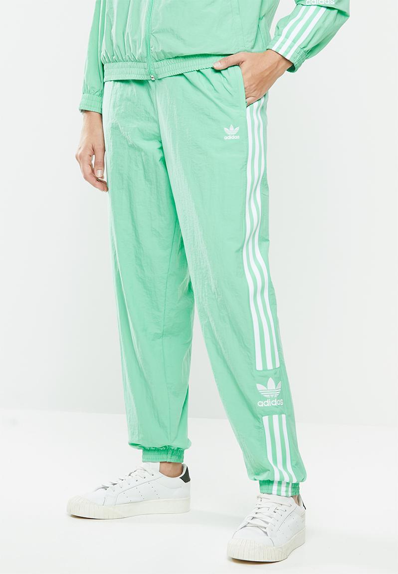 black and neon green track pants