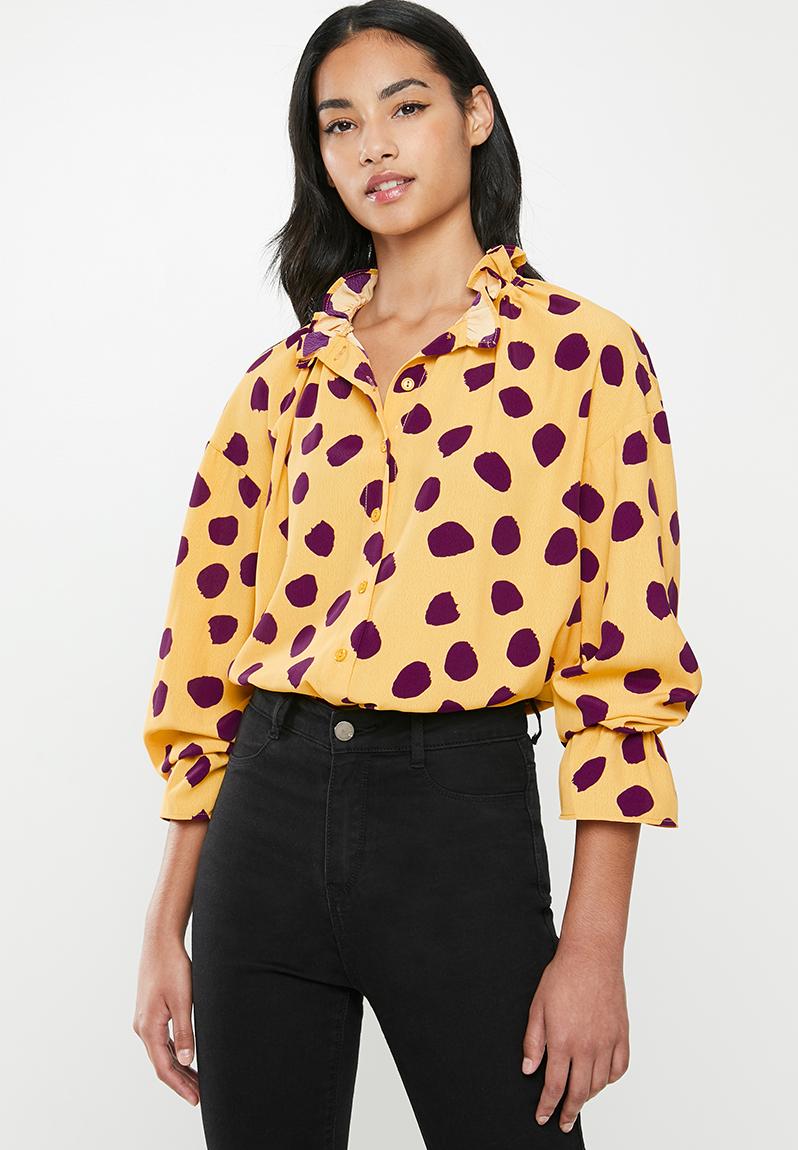 purple and yellow blouse