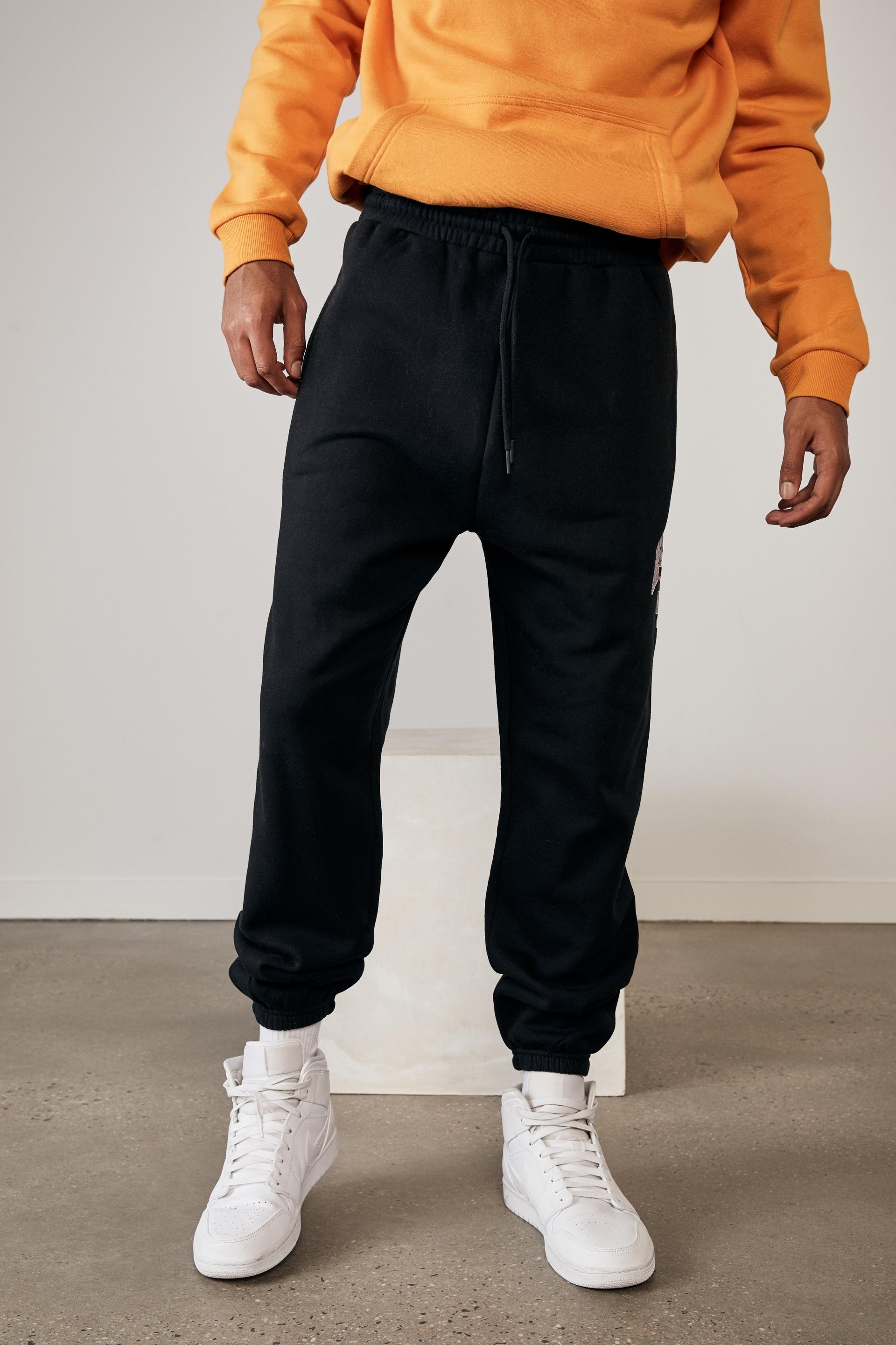 Relaxed graphic trackpant - black/new hampshire Factorie Pants & Chinos ...