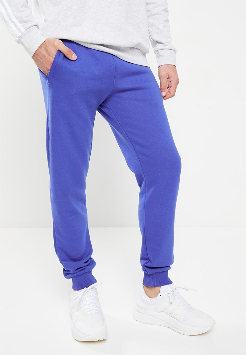 Essential trf pant m - semi lucid blue adidas Originals Sweatpants ...