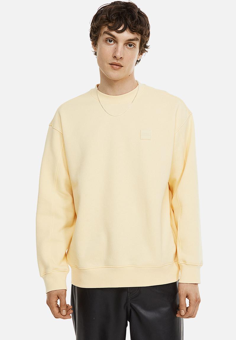 Relaxed fit appliquéd sweatshirt - light yellow - 1070927009 H&M ...