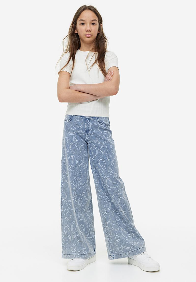 Wide printed trousers - light denim blue/smileyworld® - 1126576004 H&M ...