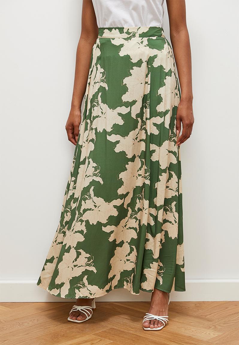 Green slit skirt with multicolour cut blouse