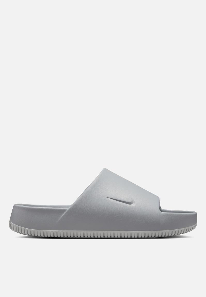 grey and white nike sandals