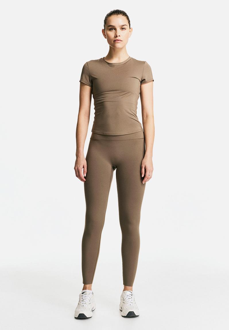 WERTHY COMBINATION LEGGINGS ブラック×ベージュ Sports leggings with softmove™ - dark beige - 1237735014