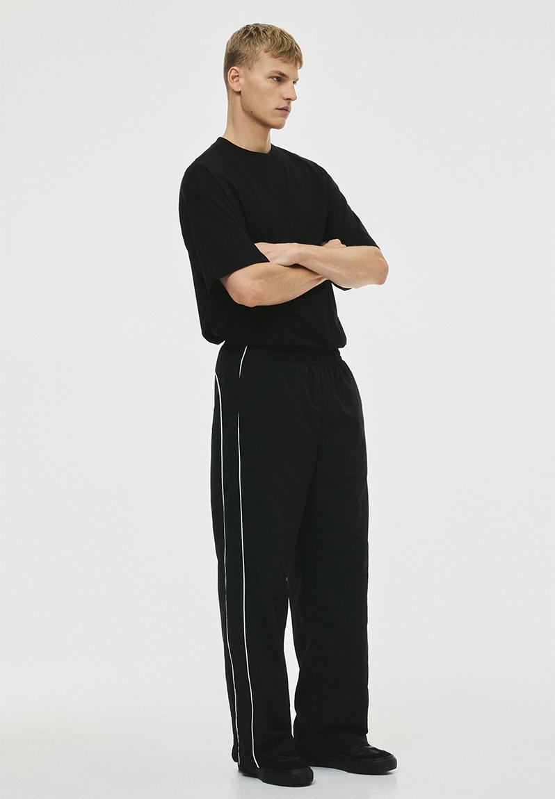 Relaxed fit nylon track pants - black - 1308781001
