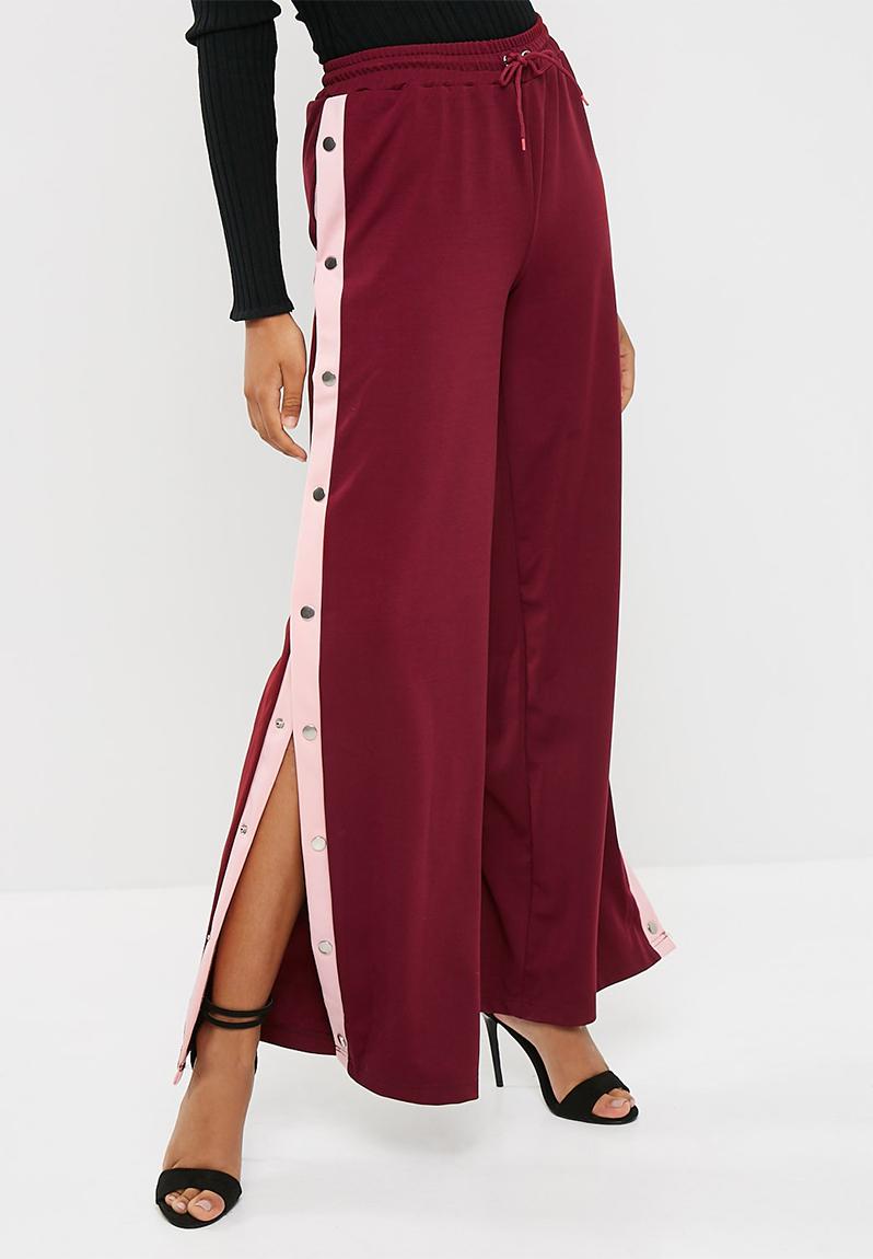Popper wide leg jogger - burgundy / pink Missguided Trousers ...